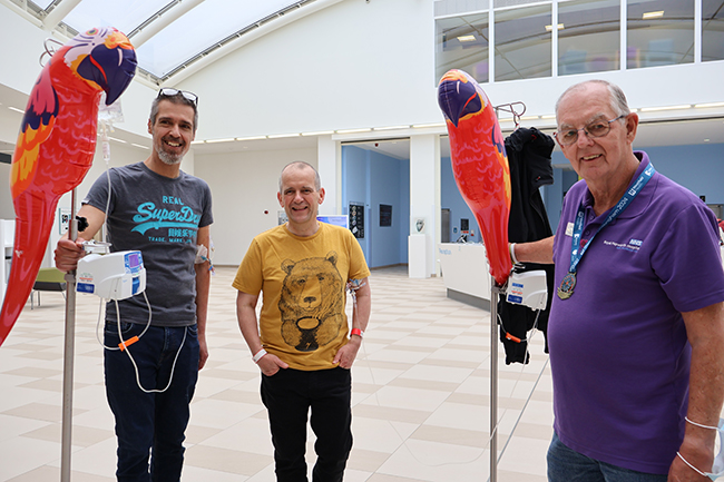 Royal Papworth Charity Volunteers with patients in the hospital atrium